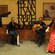 2 dancers stand by a seated dancer and a man with a guitar